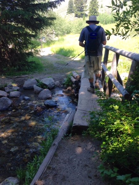 A narrow footbridge aids your passage over Corral Creek near the trailhead.