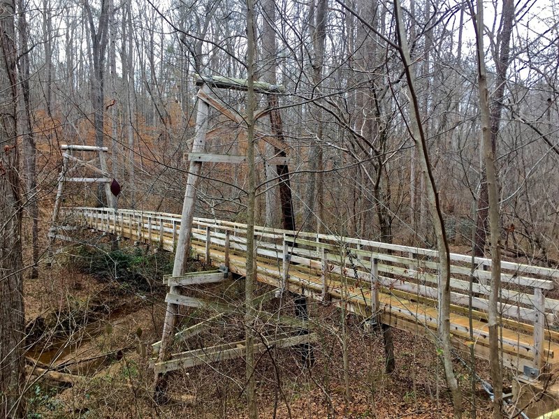 A monstrous suspension bridge aids your passage over Walnut Creek.