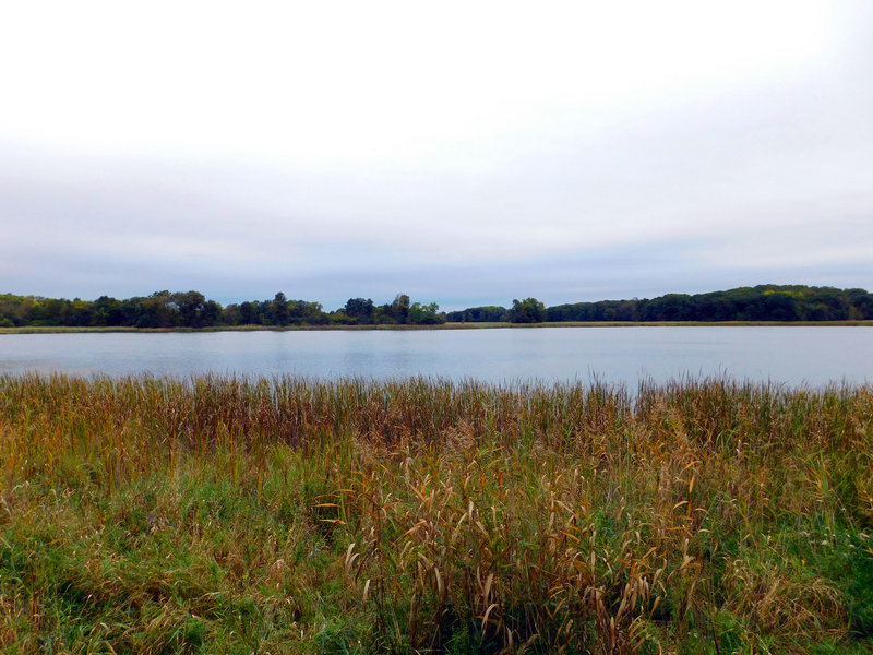 The glassy waters of Lake Maria shine in the afternoon light.