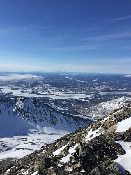 In March, enjoy expansive, snow-covered views from just below the summit on Matanuska Peak.