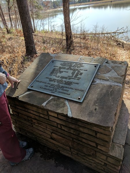 Along the trail, a monument and placard stand to commemorate the Marbury Creek Watershed Project.