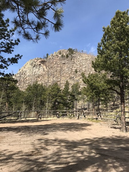 The trail starts just past the fence and heads to the top of Signal Butte.