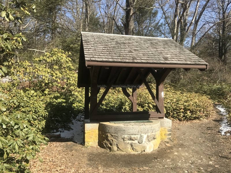 A wishing well is located just off the trail.