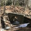 A concrete footbridge aids your passage over this small drainage.