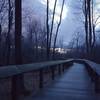 The sun sets over the bridge by the Mazza Grandmarc Apartments.