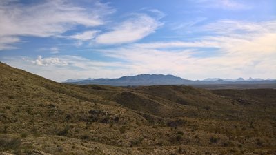 The Rosillos Mountains command the center of the image, while the Chisos Mountains are behind them in the distance.