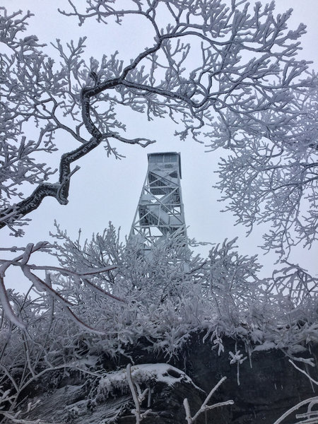 The fire tower was covered in plenty of ice amidst the throes of winter.