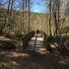 A sturdy bridge crosses a feeder stream that eventually joins Smith Creek.