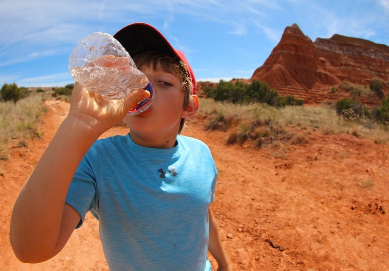 A parched Gabriel quenches his thirst on the Lighthouse Trail.