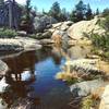 When you arrive at this pool of water, enjoy a quick look on the way up before you continue on the climb. You'll have plenty of time to enjoy it on the way down.