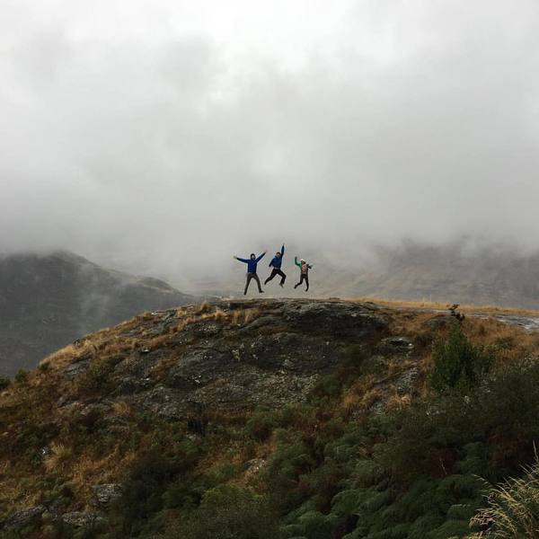 A group jumps for joy on the Diamond Lake Track.