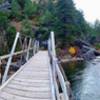 A sturdy bridge aids your passage over the Tongue River to a cool cave!