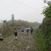 The group walks up the hill to Aldea la Trinidad Tajumulco