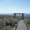 There is a small seating area with views of the New Mexico and Texas countryside from the top of the ridge.