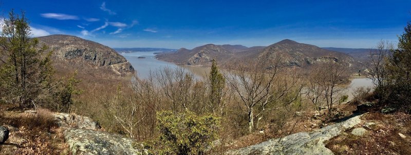 View of Storm King Mountain on left, Breakneck Ridge center across river, and Mt. Taurus on right across river.
