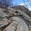 The trail up Butter Hill is marked by paint stripes on its rocky tread.