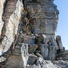 The trail is inundated with rockfall underneath the cliff.