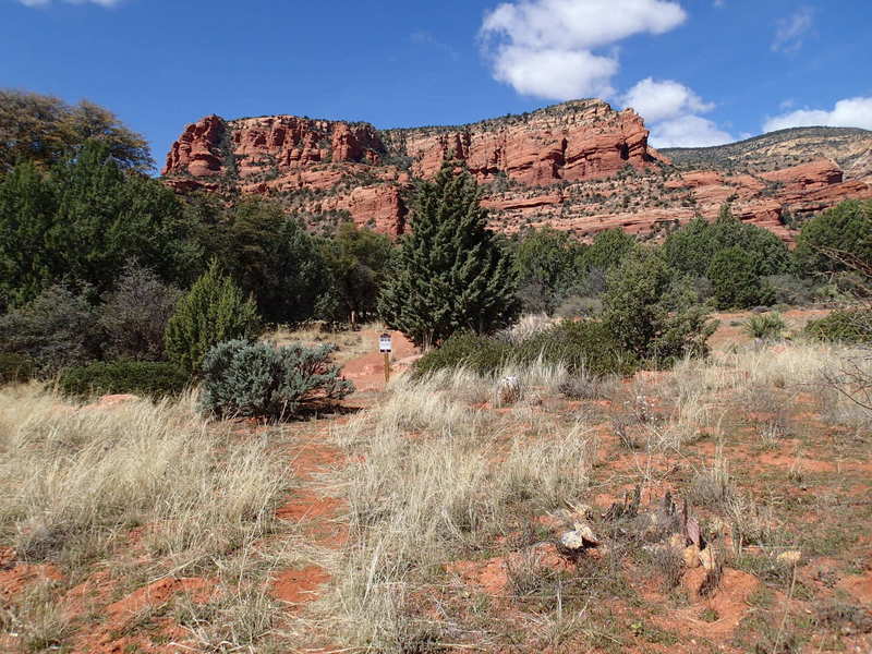 The trailhead to Fay Canyon is marked by the small sign in the distance.