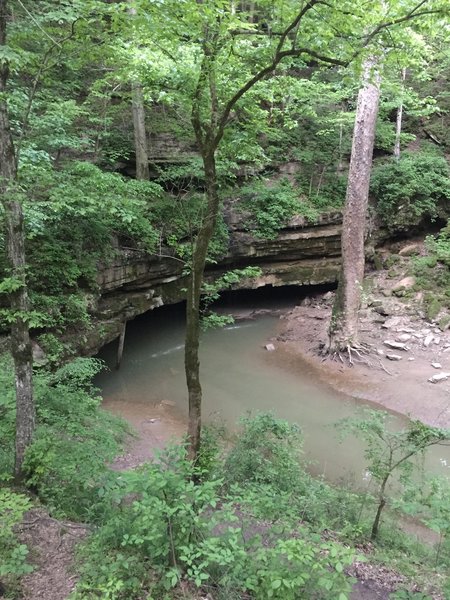 The River Styx spills from the cave mouth down to the Green River.