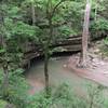 The River Styx spills from the cave mouth down to the Green River.