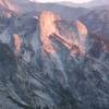 The sun sets on a rock fin west of Mt. Stewart.