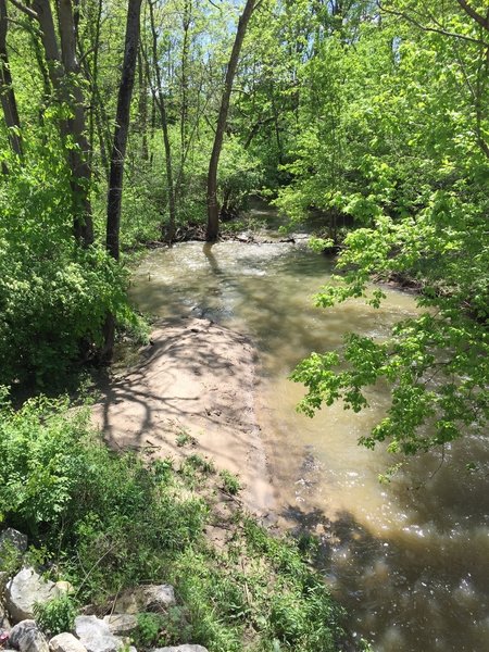 The trail traverses a bridge over the East Fork White Lick Creek.