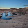 The sun sets over Reflection Canyon.