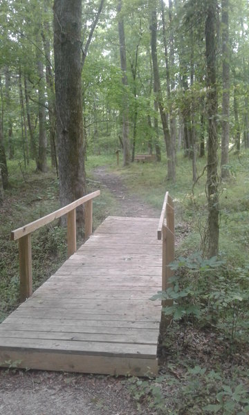 A sturdy footbridge aids your passage along the trail.