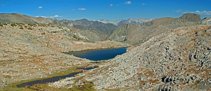 These are the lakes northwest of Peak 11493. You can make a fairly steep descent among the talus to the smaller lake in the foreground from the trail.