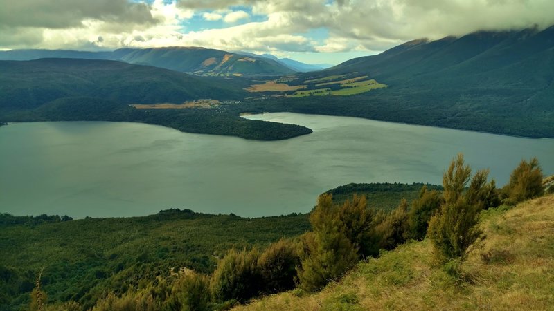 Lake Rotoiti is stunning. In the distance (center, with clear blue sky) is the valley of the Blenheim wine region.