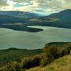 Lake Rotoiti is stunning. In the distance (center, with clear blue sky) is the valley of the Blenheim wine region.