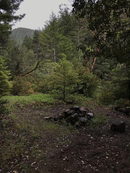 A fire ring marks an old campsite near the confluence of Craigs Creek and the South Fork Smith River.