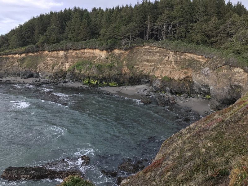 Check out the cool view of a sea cave from Megwil Point.