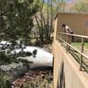 A hiker inspects the dam outlet into North St. Vrain Creek.
