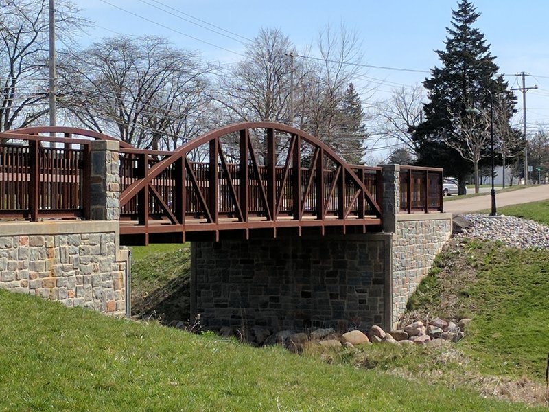 A steel bridge aids your passage over this drainage.