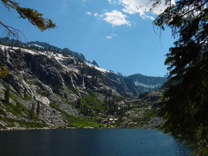 An alpine lake with waterfalls on the granite cliffs high in the Trinity Alps Wilderness Area in Northern California. from Prindleman under CC BY-SA