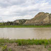 The muddy Little Missouri River flows alongside the Ekblom Trail.