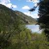 You can catch beautiful glimpses of Lower Palisades Lake through windows in the trees.