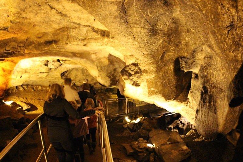 Old graffiti marks the way through the cave.