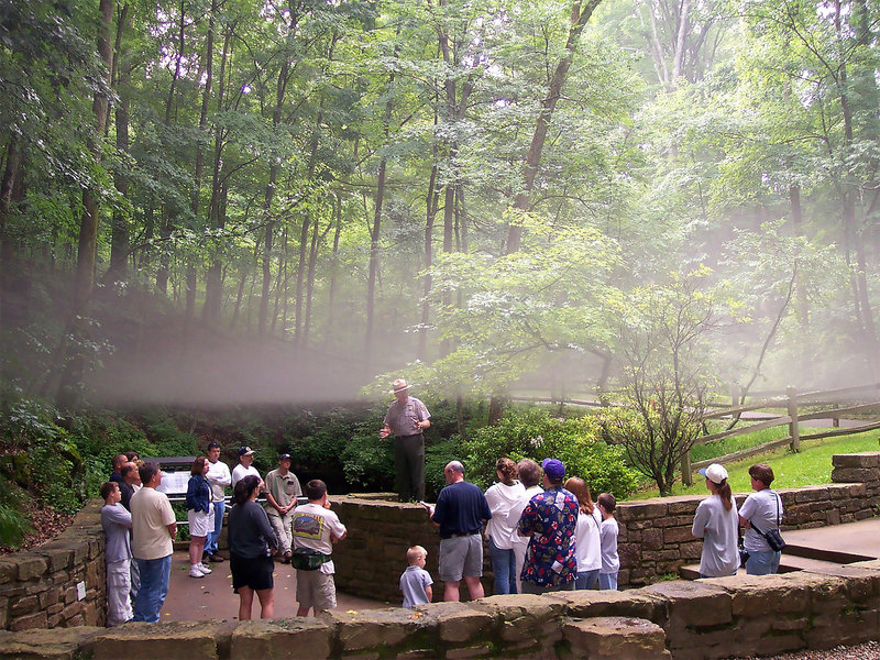 A tour group gathers around the Historic Entrance before entering Mammoth Cave. Photo credit: NPS Photo.