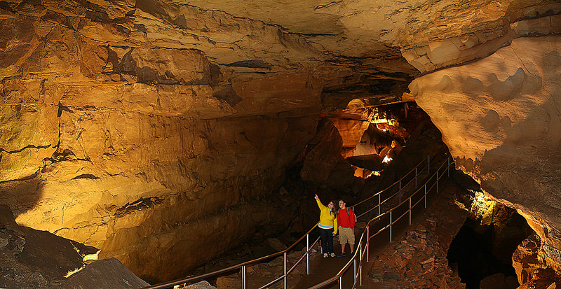 Visitors enjoy the narrow passage of Thanksgiving Hall in Mammoth Cave. Photo credit: NPS Photo.