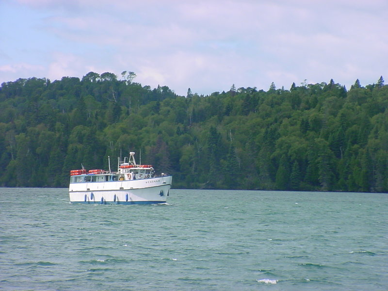 The Isle Royale ferry Wenonah crosses the calm waters of Washington Harbor.