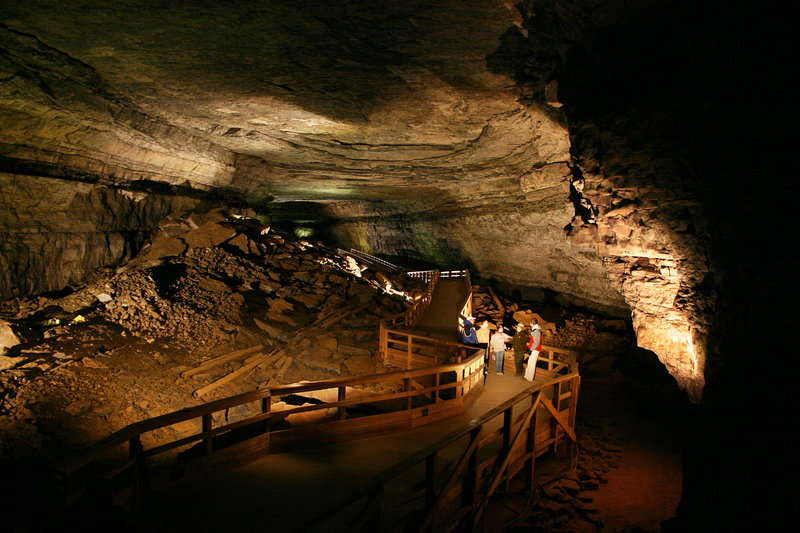 Visitors learn about Mammoth Cave from a ranger in the Broadway section of the cave.