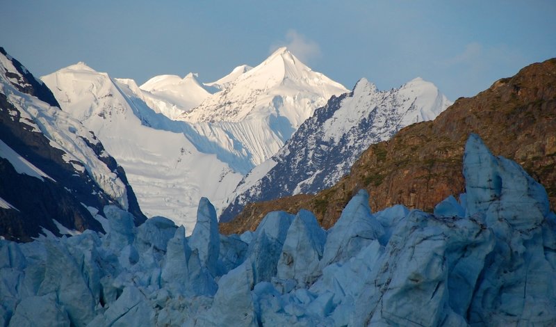 Sunrise hits the Fairweather Mountains above the Margerie Glacier. Photo credit: NPS Photo.