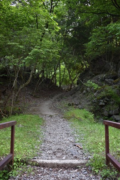 Crossing a river leads to this pleasant path.