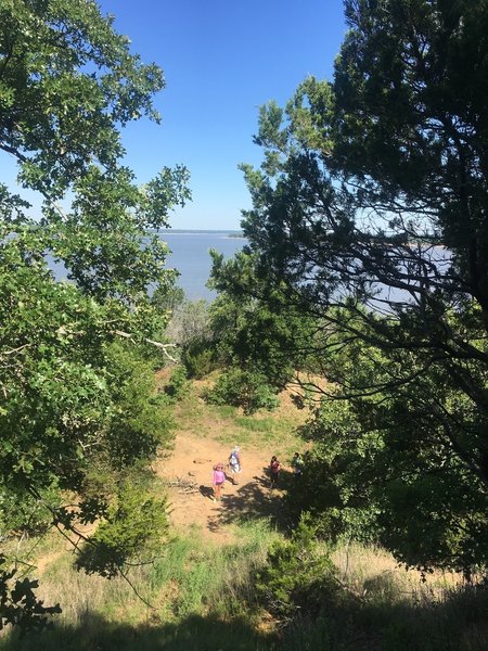 Hikers navigate the beautiful lakeside trail.