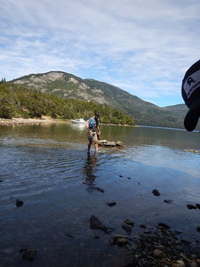 An adventurer crosses the Rio Hermoso to start the loop!