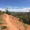 The Red Ridge Trail, that ties into the Johnny Draw Trail, is narrow singletrack on red rock with excellent views of the surrounding basin and the Wind River Range.