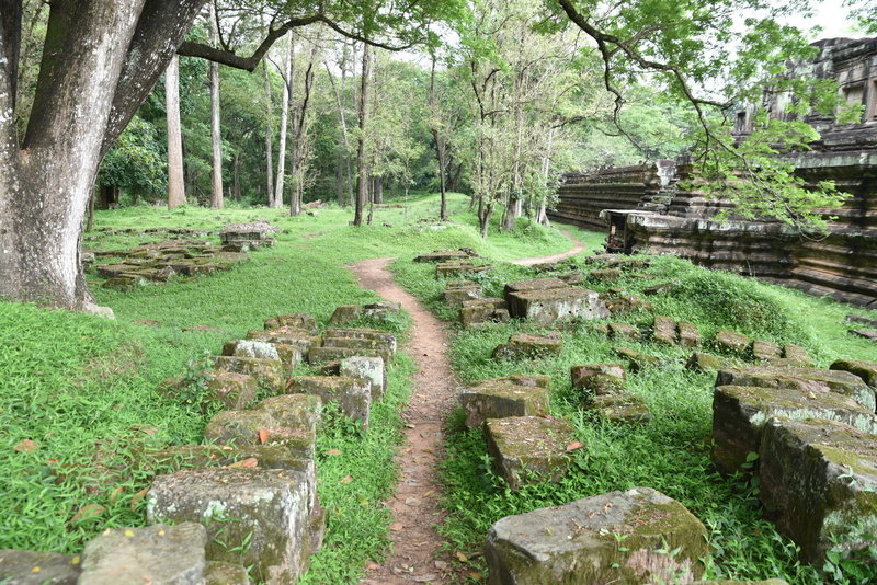The Baphuon Temple trail wanders past scattered stones.