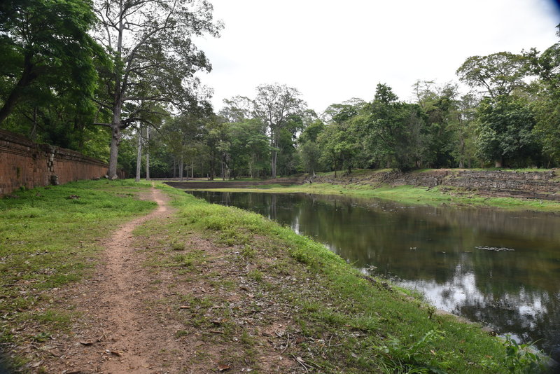 Looping back on the Sras Srei Trail along a wall on the north side.